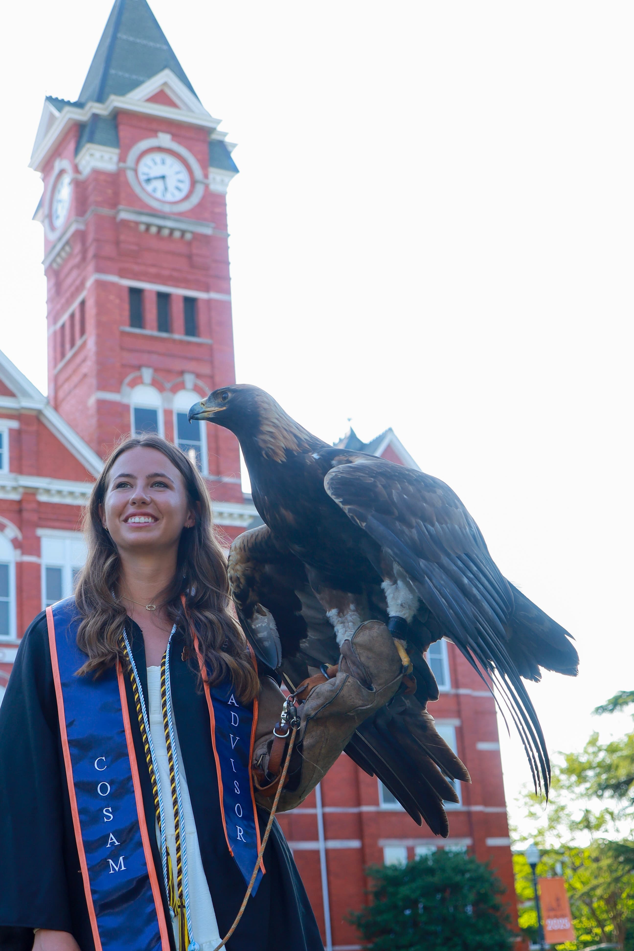 Katelynn at graduation with golden eagle